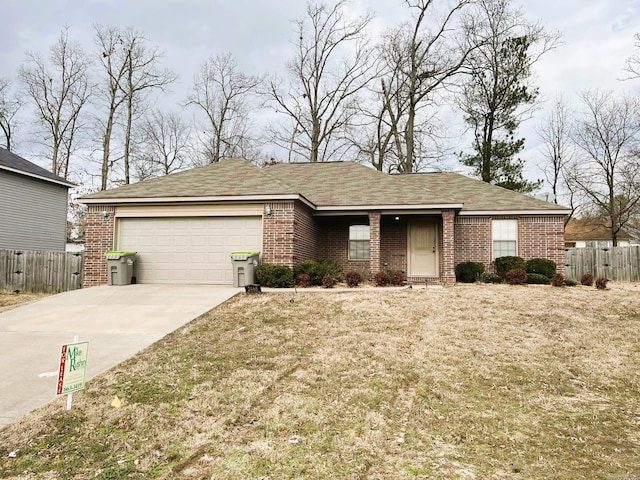 ranch-style home with a front lawn and a garage