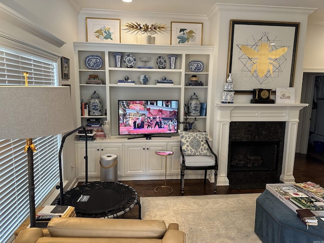 living room featuring dark hardwood / wood-style floors, crown molding, and a high end fireplace