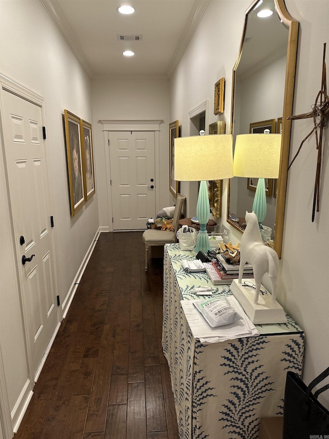 hall featuring dark hardwood / wood-style floors and ornamental molding