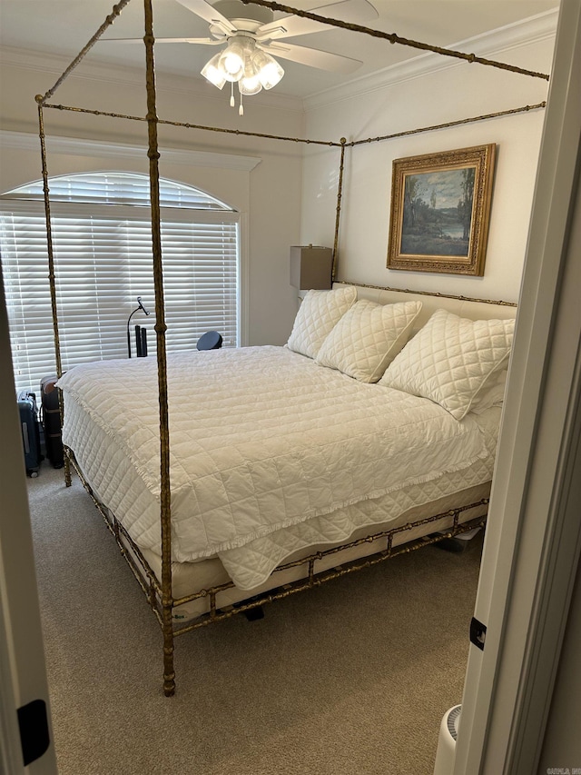 bedroom featuring ceiling fan, carpet floors, and crown molding