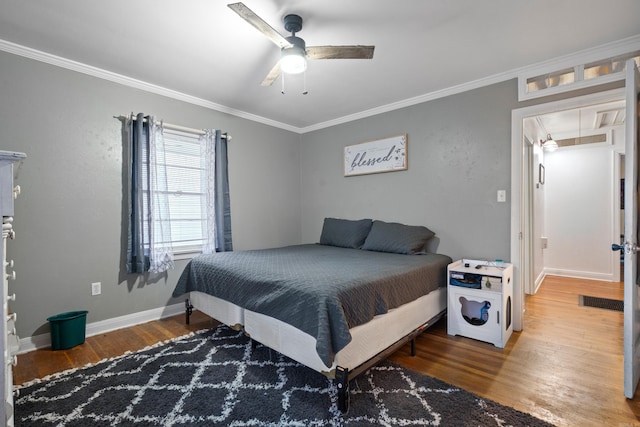 bedroom with ceiling fan, crown molding, and hardwood / wood-style flooring