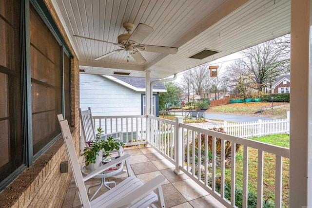 balcony with ceiling fan and covered porch