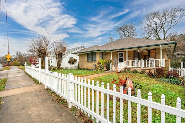 single story home with a front yard and a porch