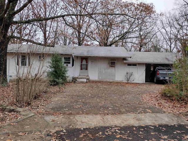 single story home featuring a carport