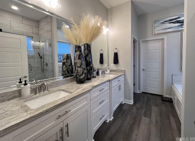 bathroom featuring separate shower and tub, vanity, and hardwood / wood-style flooring