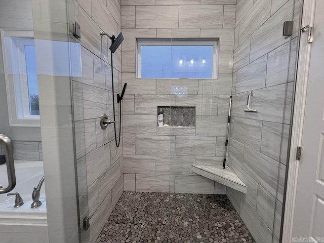 bathroom with walk in shower and a wealth of natural light