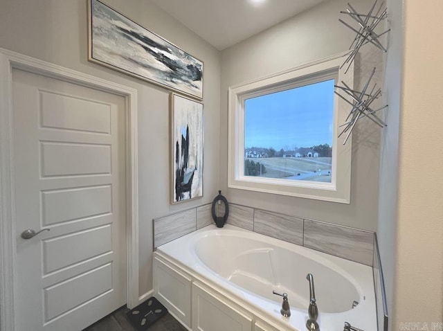 bathroom featuring a tub to relax in