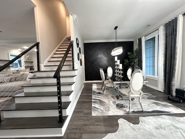 dining space featuring an inviting chandelier, crown molding, and dark wood-type flooring