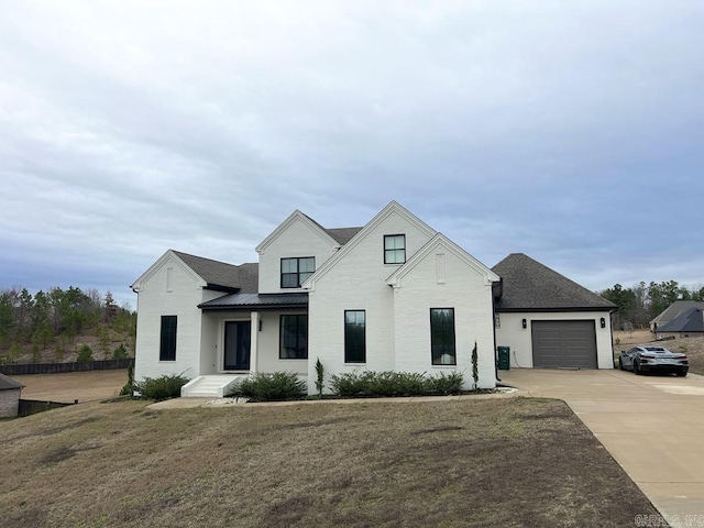 modern farmhouse with a front lawn and a garage