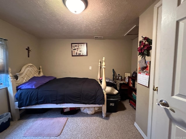 carpeted bedroom featuring a textured ceiling