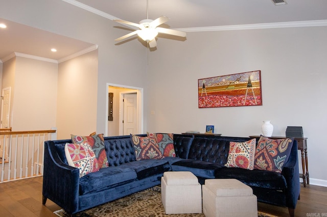 living room featuring ceiling fan, ornamental molding, and dark wood-type flooring