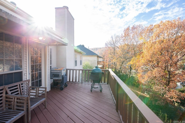 wooden deck with grilling area