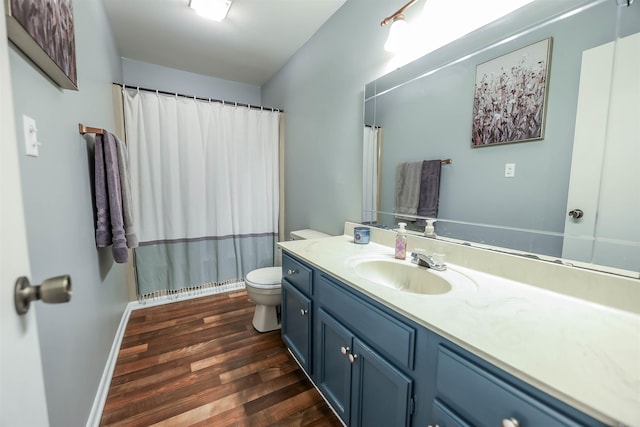 bathroom featuring hardwood / wood-style floors, vanity, and toilet