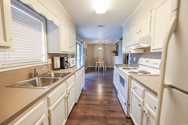 kitchen with white appliances, white cabinets, sink, a textured ceiling, and dark hardwood / wood-style flooring