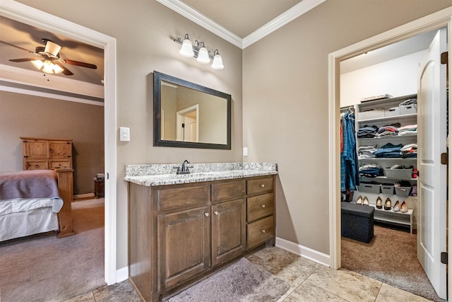 bathroom featuring vanity, ceiling fan, and crown molding