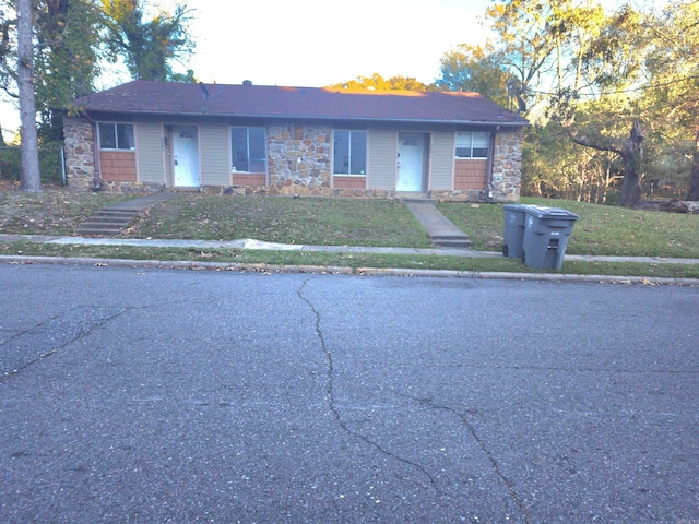 ranch-style house with a front lawn