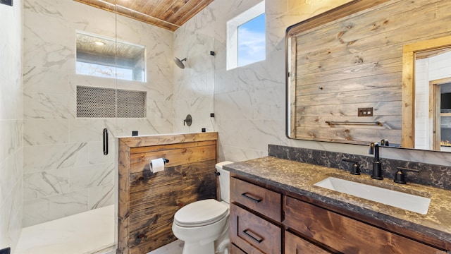 bathroom with wooden ceiling, toilet, a shower with door, vanity, and tile walls