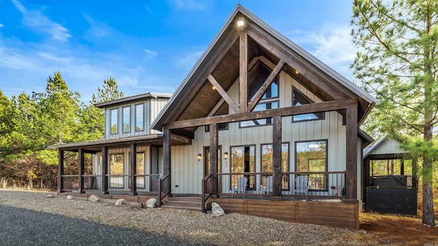 rear view of house with french doors and a porch