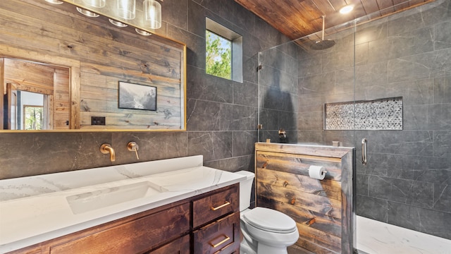 bathroom with walk in shower, toilet, plenty of natural light, and tile walls