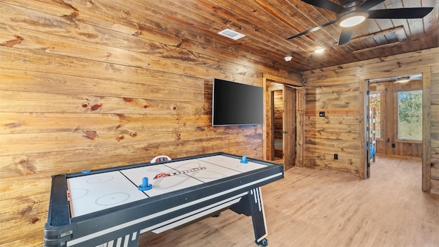 playroom featuring wood walls, hardwood / wood-style floors, ceiling fan, and wood ceiling