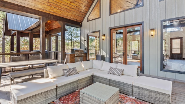 sunroom / solarium with a wealth of natural light, french doors, wood ceiling, and lofted ceiling