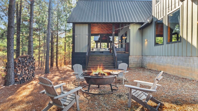 view of patio / terrace with an outdoor fire pit