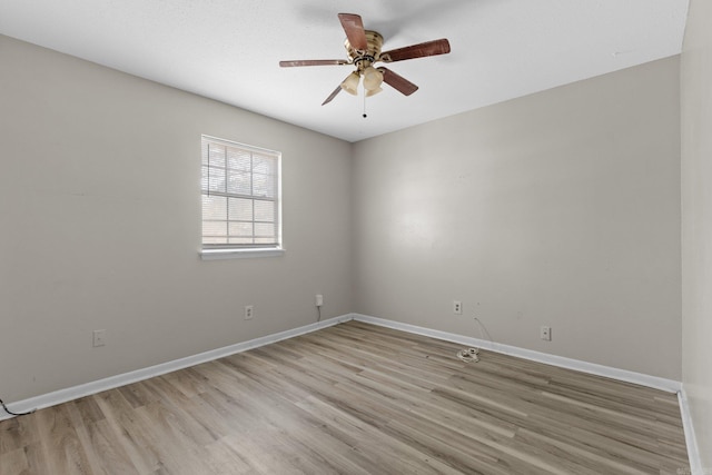 spare room with light hardwood / wood-style floors and ceiling fan