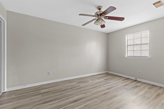 spare room featuring ceiling fan and light wood-type flooring