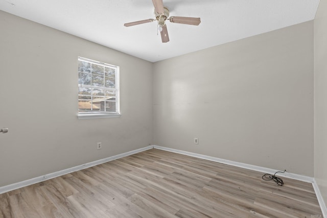 unfurnished room with ceiling fan and light wood-type flooring