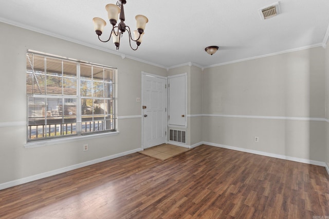 interior space with crown molding, hardwood / wood-style floors, and an inviting chandelier