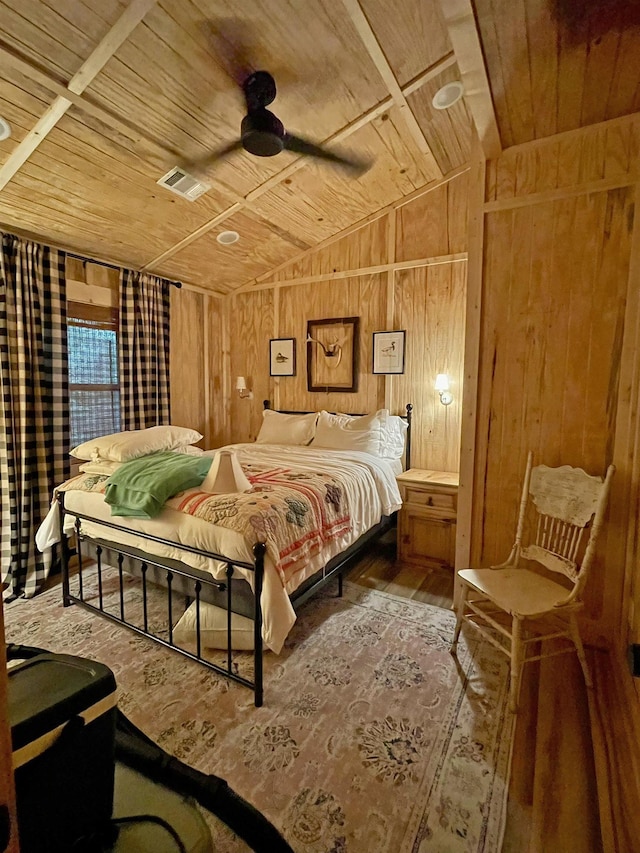 bedroom featuring hardwood / wood-style flooring, vaulted ceiling, ceiling fan, and wooden ceiling