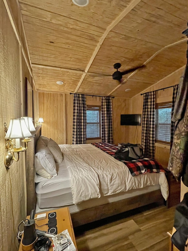 bedroom featuring hardwood / wood-style floors, wooden walls, and wood ceiling