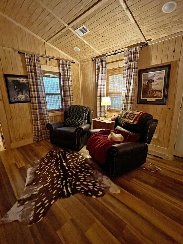 living room featuring wood walls and wooden ceiling