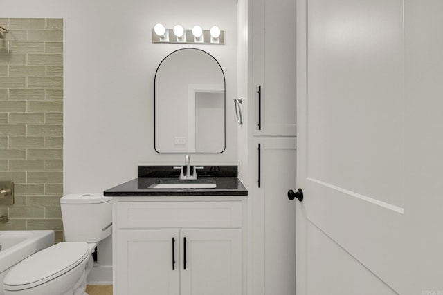 full bathroom featuring bathing tub / shower combination, vanity, and toilet