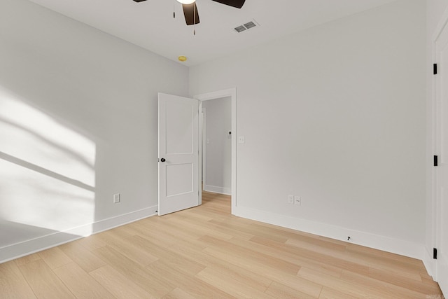 unfurnished room with ceiling fan and light hardwood / wood-style flooring