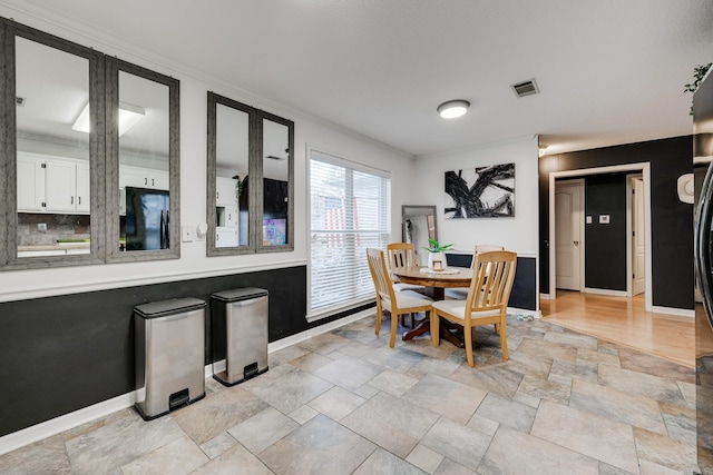 dining area featuring ornamental molding