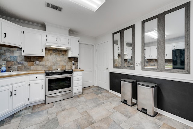 kitchen with sink, tasteful backsplash, crown molding, stainless steel electric range, and white cabinets