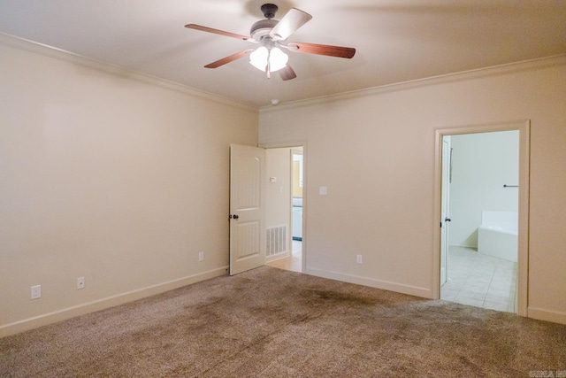 unfurnished bedroom featuring light carpet, connected bathroom, ceiling fan, and crown molding