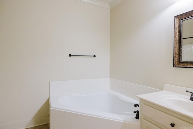 bathroom featuring a washtub, vanity, and ornamental molding