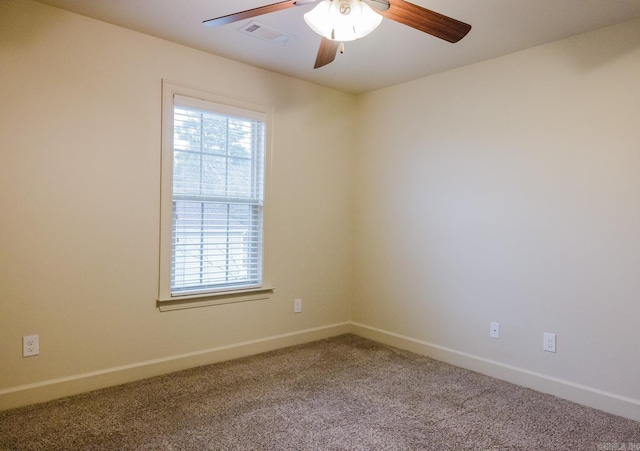 empty room with carpet and ceiling fan