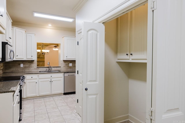 kitchen with sink, stainless steel dishwasher, decorative backsplash, electric range, and white cabinetry