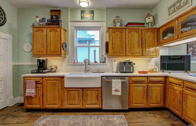 kitchen featuring dishwasher, dark hardwood / wood-style floors, and sink