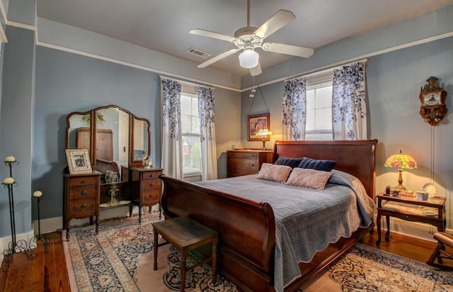 bedroom with hardwood / wood-style flooring and ceiling fan