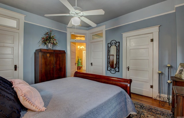 bedroom featuring ceiling fan and wood-type flooring