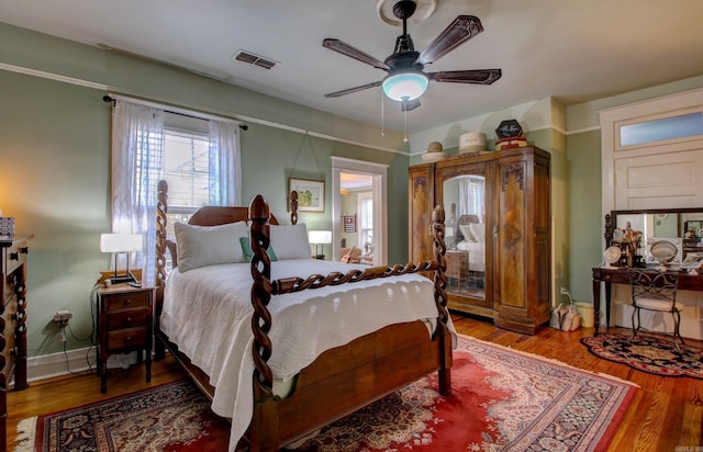 bedroom featuring ceiling fan and hardwood / wood-style flooring