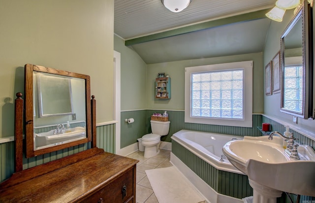 bathroom featuring tile patterned flooring, lofted ceiling, and toilet