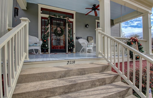 doorway to property with ceiling fan and covered porch