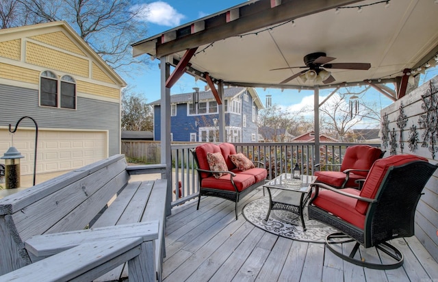 wooden deck featuring an outdoor living space and ceiling fan