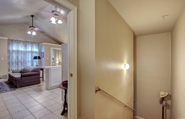 interior space featuring light tile patterned flooring and lofted ceiling