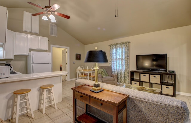 living room featuring high vaulted ceiling, ceiling fan, and light tile patterned flooring